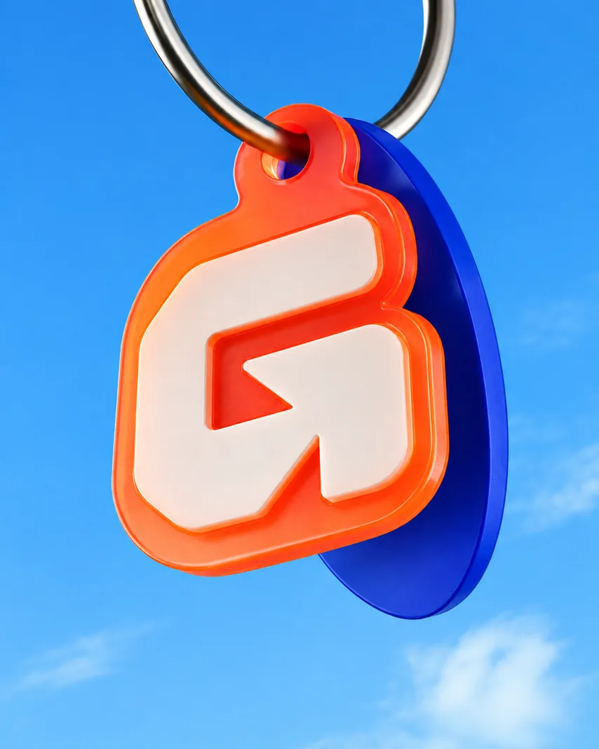 Graded keyring charm against a blue sky